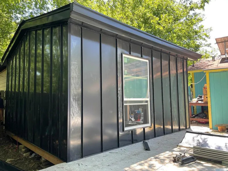 Black standing seam metal wall panels for Roof Inspection in Elburn